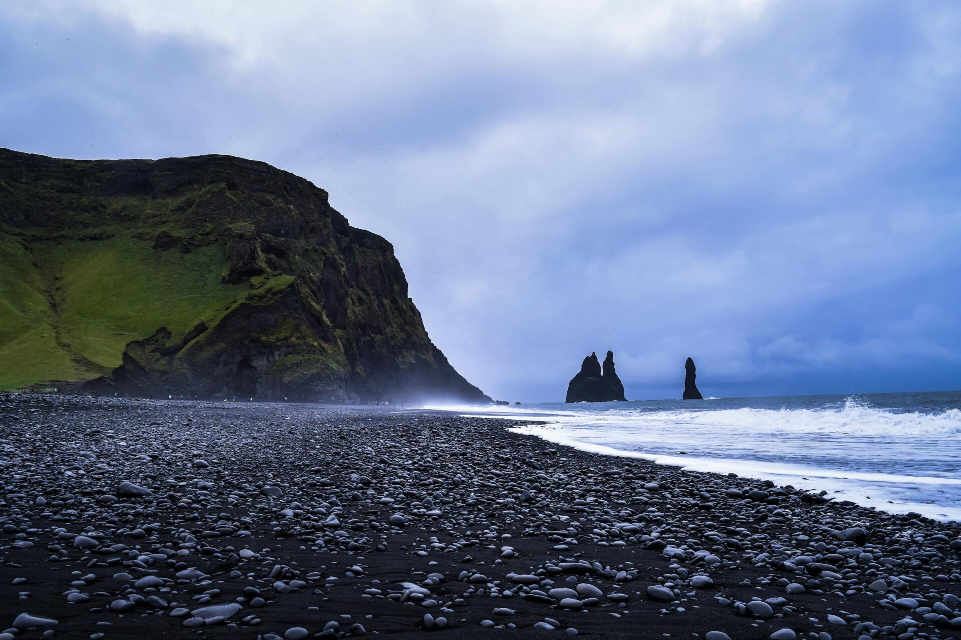 Discover the breathtaking beauty of Reynisfjara Beach with its iconic basalt sea stacks in Iceland.