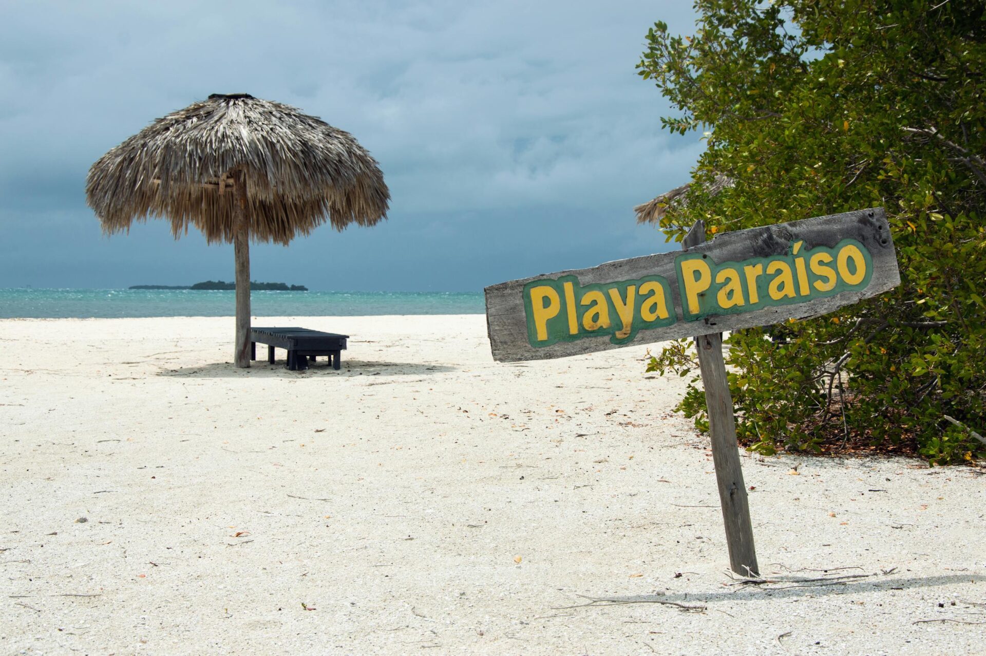 Captivating view of the beach at Playa Paraíso with a sunshade and scenic surroundings.